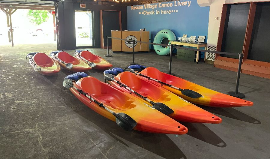 Sit-on-top kayaks ready at the livery check-in