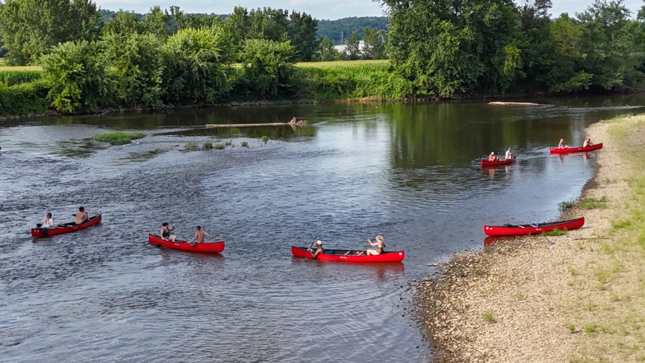 Roscoe Village Canoe Livery canoes on the river at Coshocton, Ohio