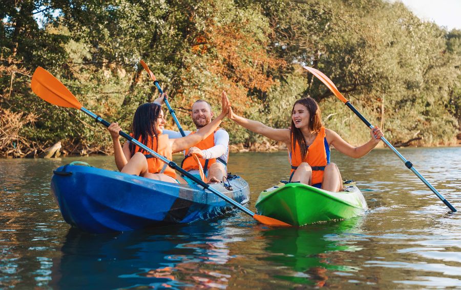 A group of friends kayaking together on an Ohio river