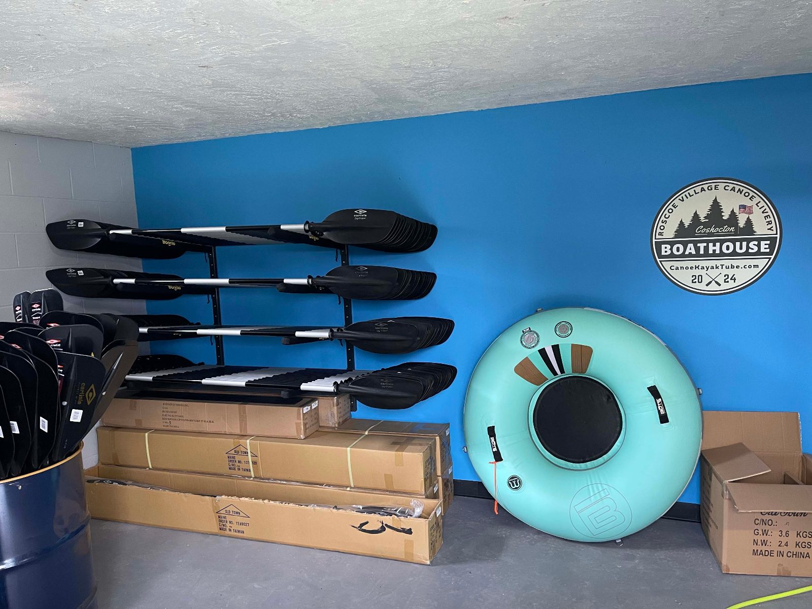 Two Roscoe Village Canoe Livery kayaks pulled up on a gravel bar on the river at Coshocton, Ohio